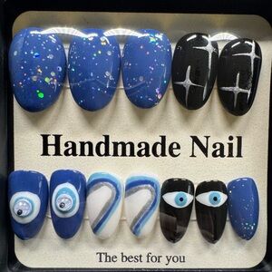 Blue, black,white hand made press on nails.  28 nails, a size for everyone.